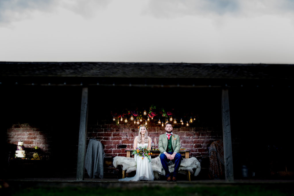 alternative bride and groom in game of thrones style wedding at high barn.