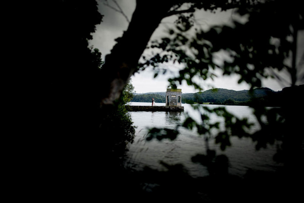 Wedding photo of a Bride and Groom on the jetty at a Storrs Hall