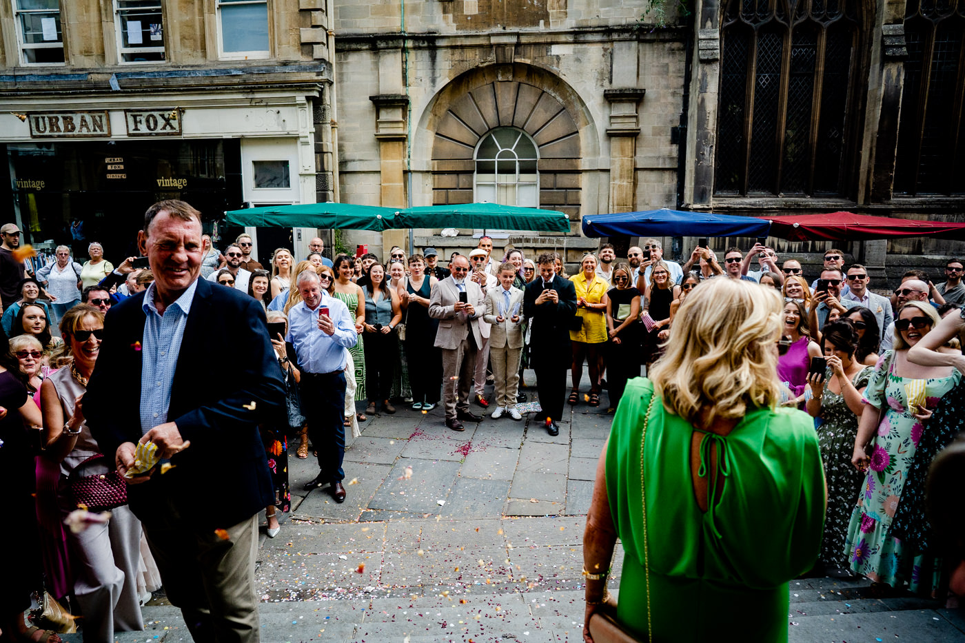 Guests throwing confetti outside Bristol Registry Office after a city centre wedding ceremony in Bristol