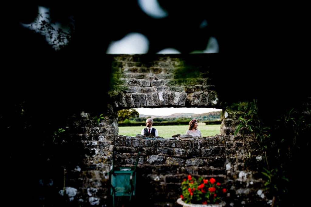 Wedding photography Bride and Groom in the walled garden at a wedding in longlands at cartmel a top lake district wedding venue 