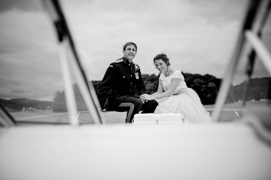 bride and groom on lake windermere