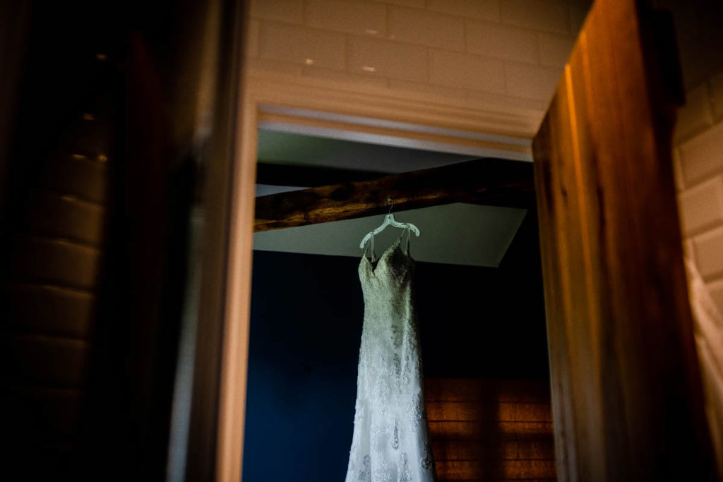 the wedding dress hanging in the bothy at high barn