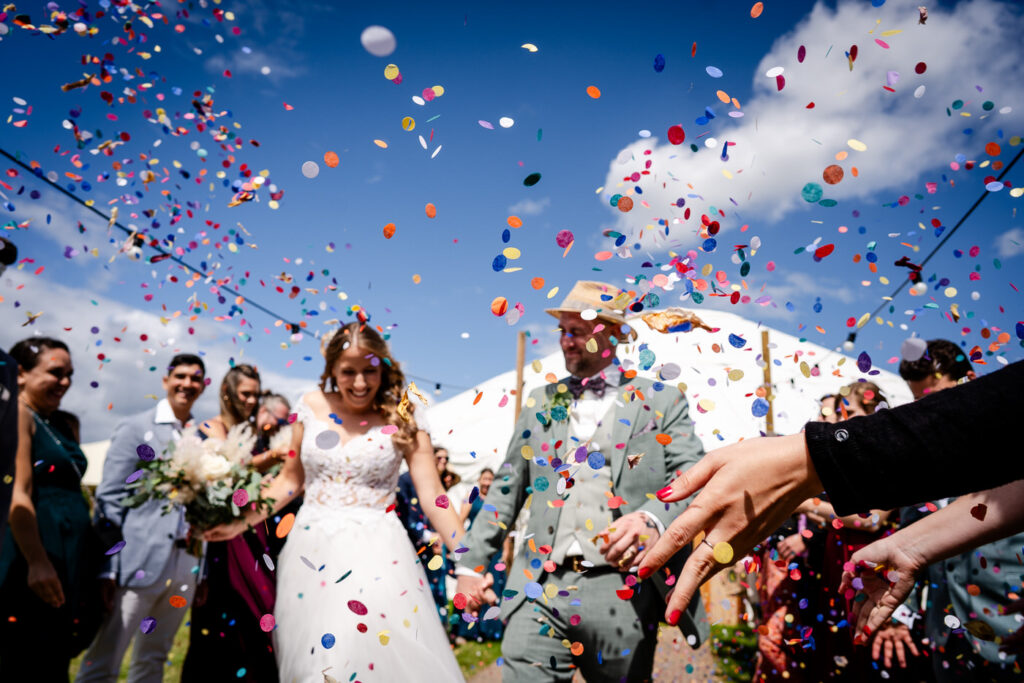 confetti with blurred couples in the background at leyfold events.
